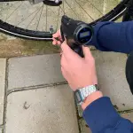 man inflating his bike with Home Pro Portable Air Pump